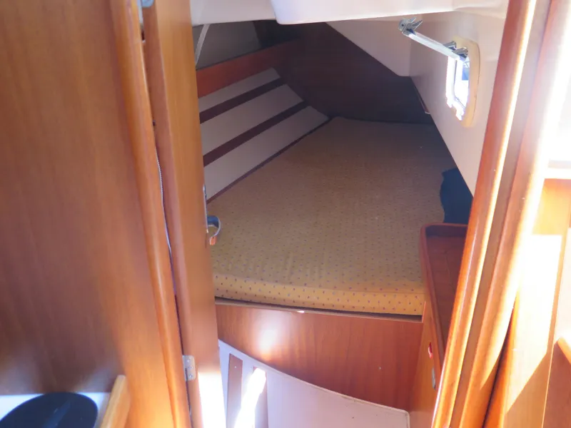Slide: The Image of Interior cabin of a 2002 Arcona 355 Sloop with a cozy bed. - 22