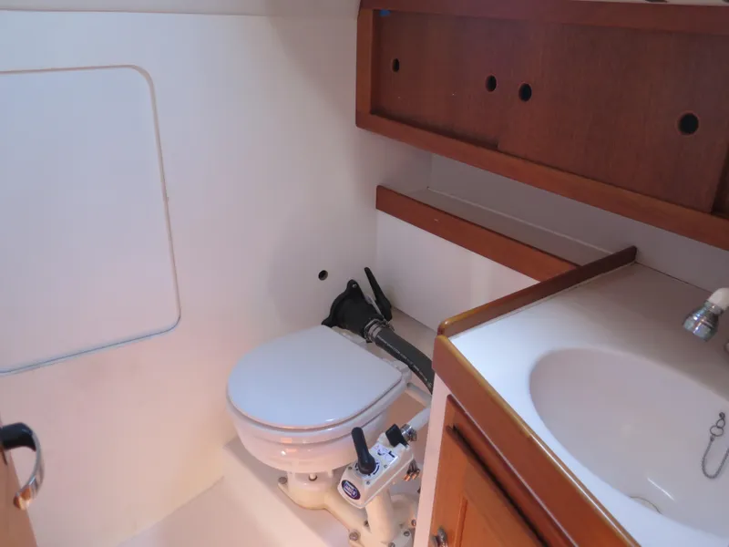 Slide: The Image of 2002 Arcona 355 Sloop bathroom with toilet and sink. - 25