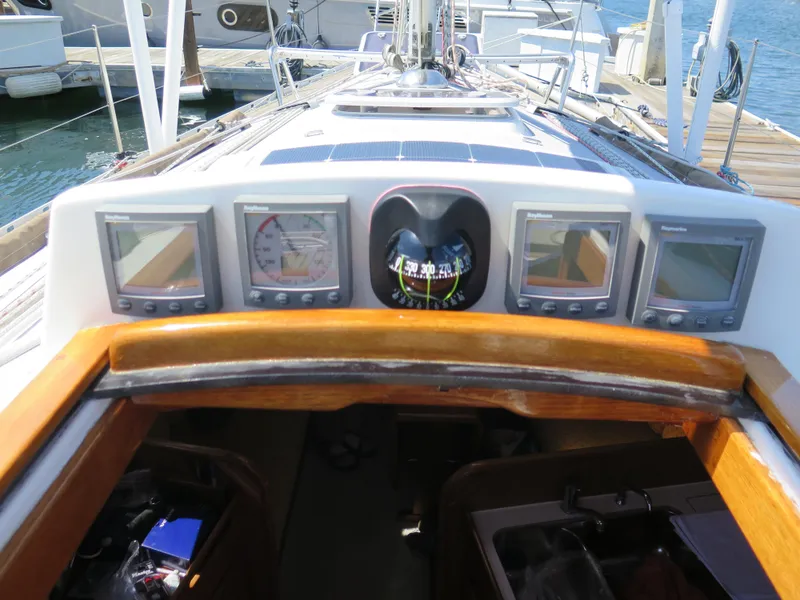 Slide: The Image of Cockpit instruments of a 2002 Arcona 355 Sloop sailboat at dock. - 30