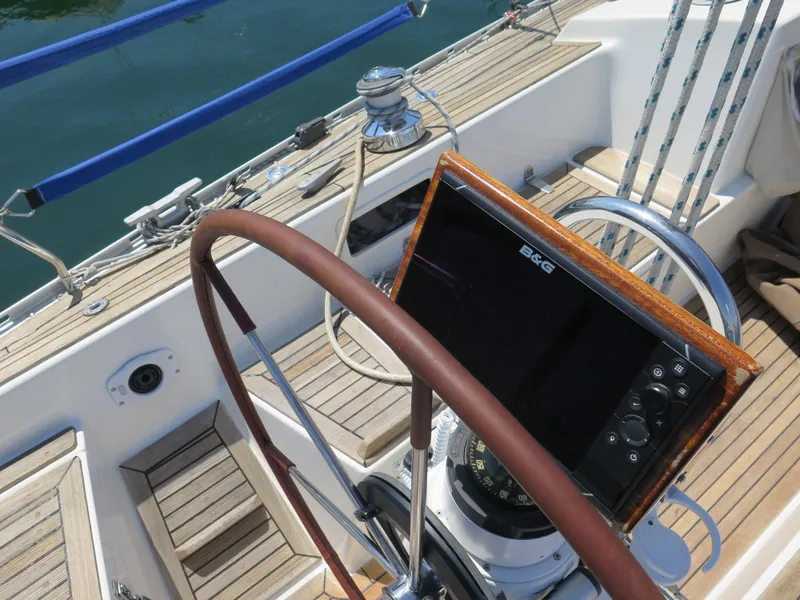 Slide: The Image of Cockpit of 2002 Arcona 355 Sloop with steering wheel and navigation equipment. - 31