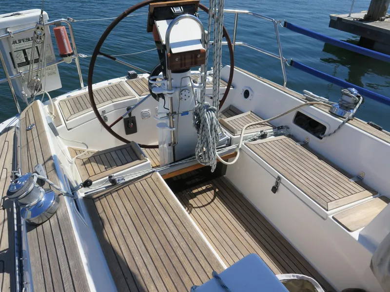 Slide: The Image of Cockpit of a 2002 Arcona 355 Sloop with wooden deck and steering wheel. - 33