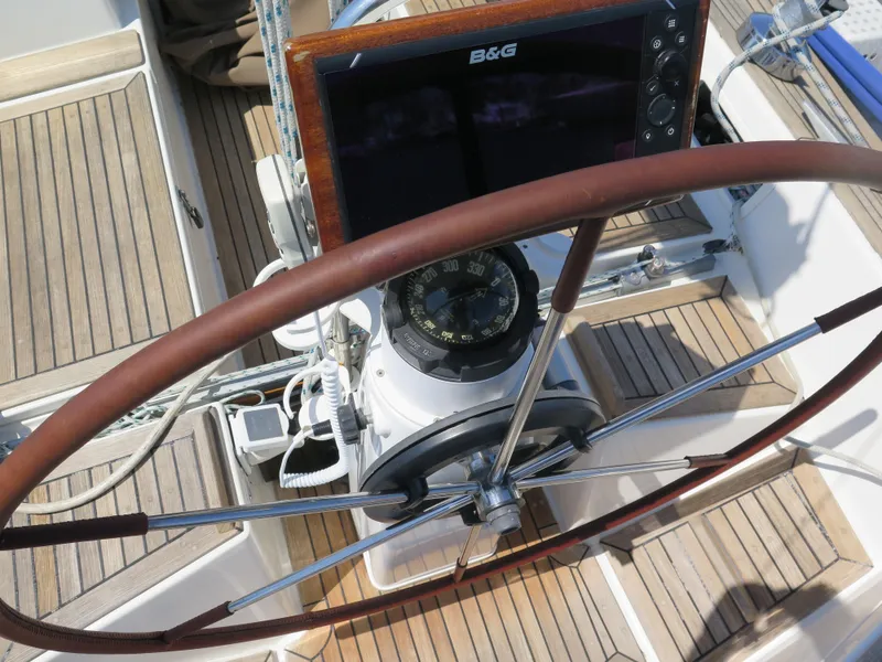 Slide: The Image of Steering wheel and navigation system of a 2002 Arcona 355 Sloop sailboat. - 35