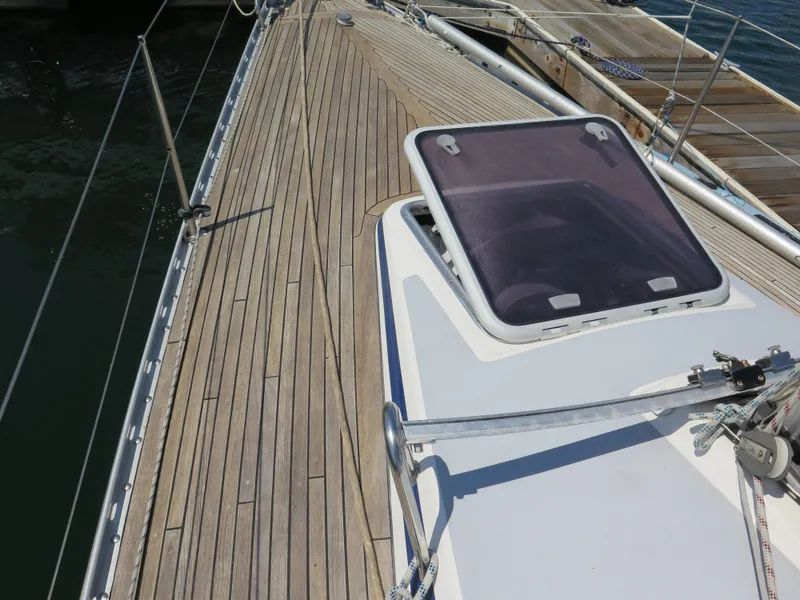 Slide: The Image of Deck of 2002 Arcona 355 Sloop with open hatch and wooden finish. - 37