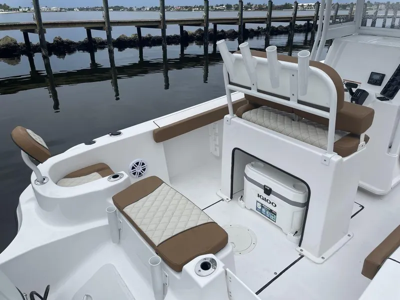 Slide: The Image of 2024 Polar 220 CC boat interior with seating and storage. - 10