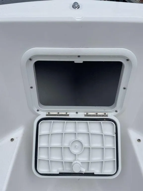 Slide: The Image of 2024 Polar 220 CC boat storage compartment - 17