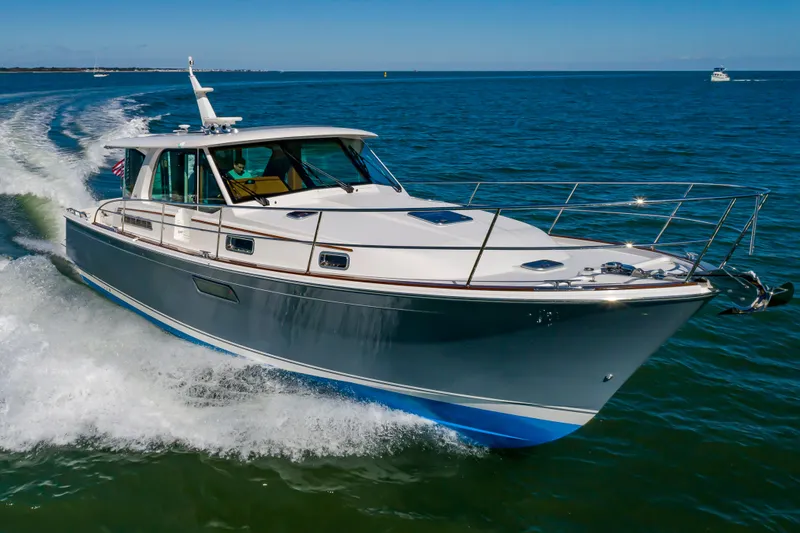 Slide: The Image of 2024 Sabre 43 Salon Express cruising on open water. - 10