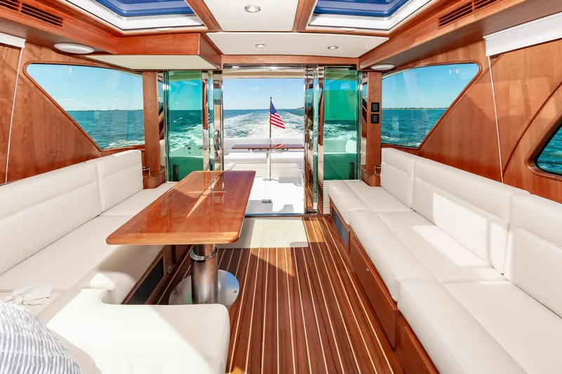 Slide: The Image of Interior of 2024 Sabre 43 Salon Express yacht with luxurious seating and ocean view. - 25