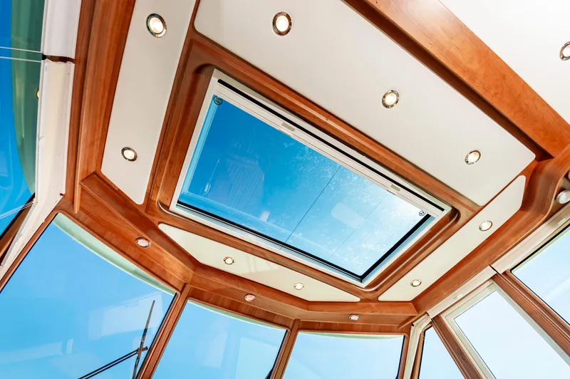 Slide: The Image of 2024 Sabre 43 Salon Express yacht interior ceiling with skylight and recessed lighting. - 33