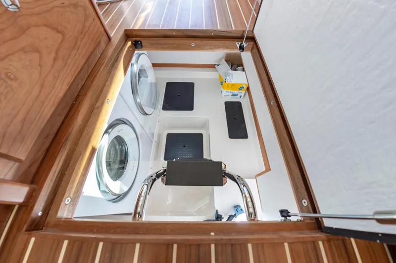 Slide: The Image of Laundry area in the 2024 Sabre 43 Salon Express yacht with washer and dryer. - 36