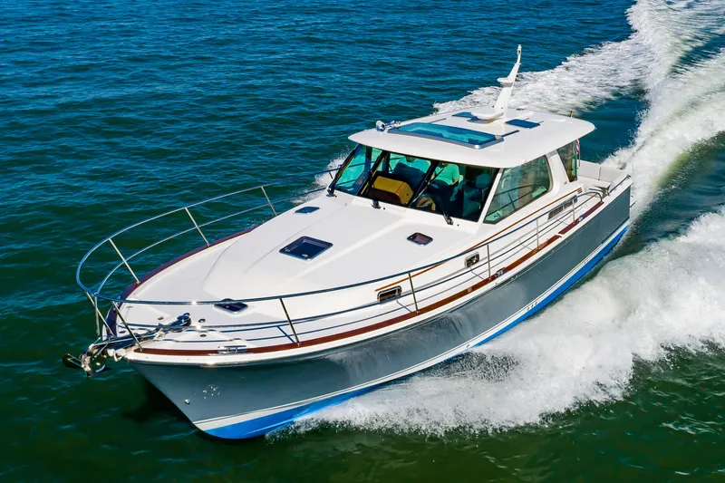 Slide: The Image of 2024 Sabre 43 Salon Express cruising on open water. - 4