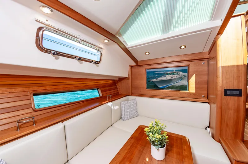 Slide: The Image of Interior of 2024 Sabre 43 Salon Express yacht with elegant seating and wooden finishes. - 45