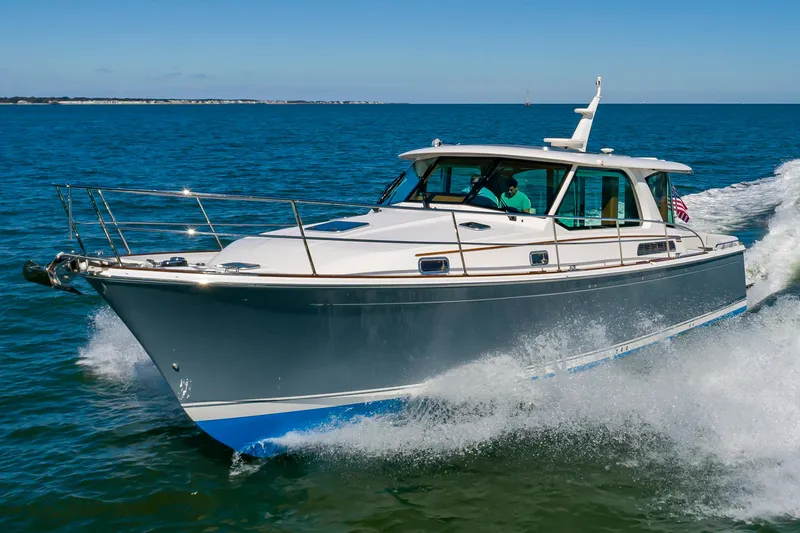 Slide: The Image of 2024 Sabre 43 Salon Express cruising on open water. - 7