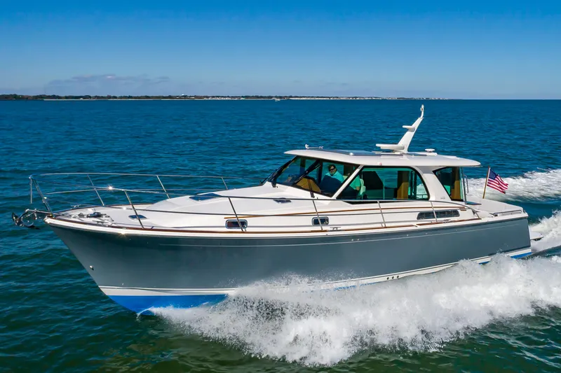 Slide: The Image of 2024 Sabre 43 Salon Express cruising on open water. - 8