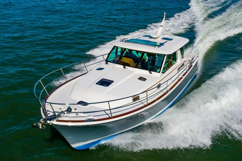 Slide: The Image of 2024 Sabre 43 Salon Express cruising on open water. - 9