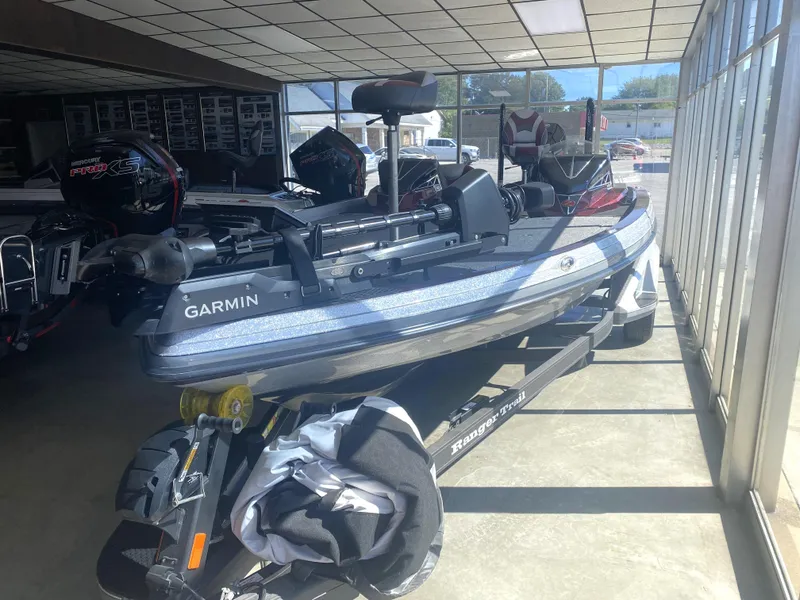 Slide: The Image of 2021 Ranger Z521L boat with Garmin equipment in a showroom. - 11