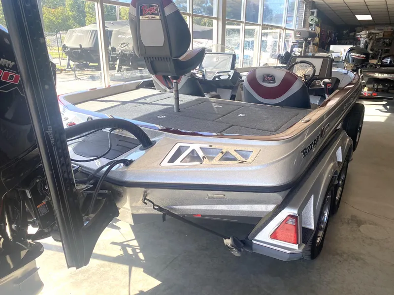 Slide: The Image of 2021 Ranger Z521L bass boat in showroom, featuring sleek design and modern seating. - 14