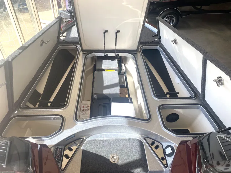 Slide: The Image of 2021 Ranger Z521L boat storage compartments with open hatches, showcasing spacious interior design. - 20