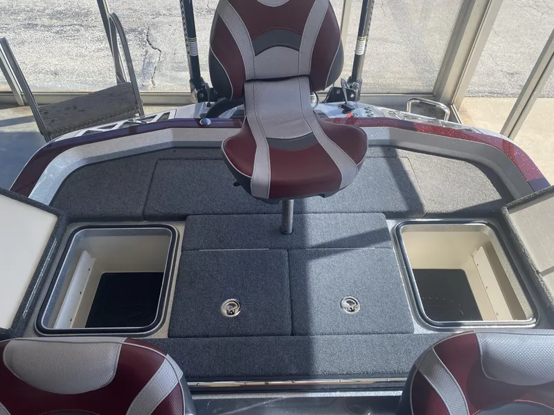Slide: The Image of 2021 Ranger Z521L boat interior with storage compartments and seating. - 22