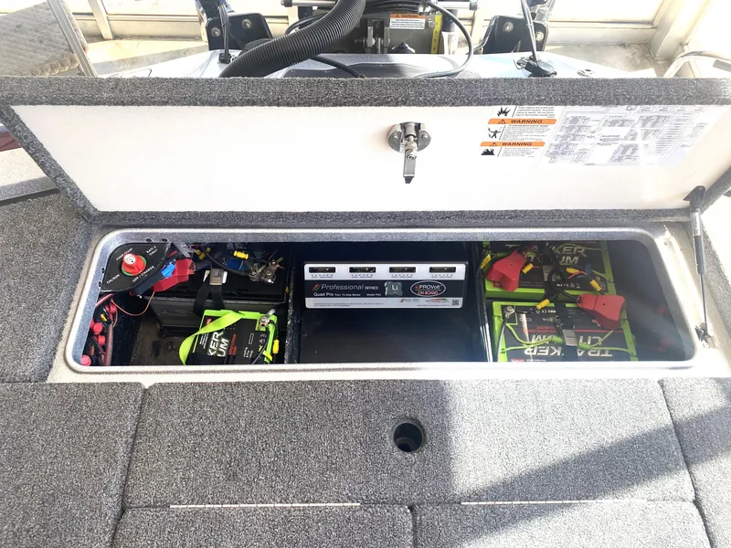 Slide: The Image of 2021 Ranger Z521L boat battery compartment with organized wiring and power management system. - 23