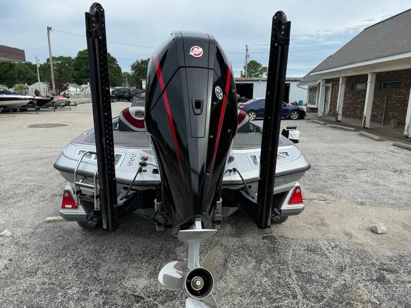 Slide: The Image of 2021 Ranger Z521L boat with powerful outboard motor, parked in a lot. - 3