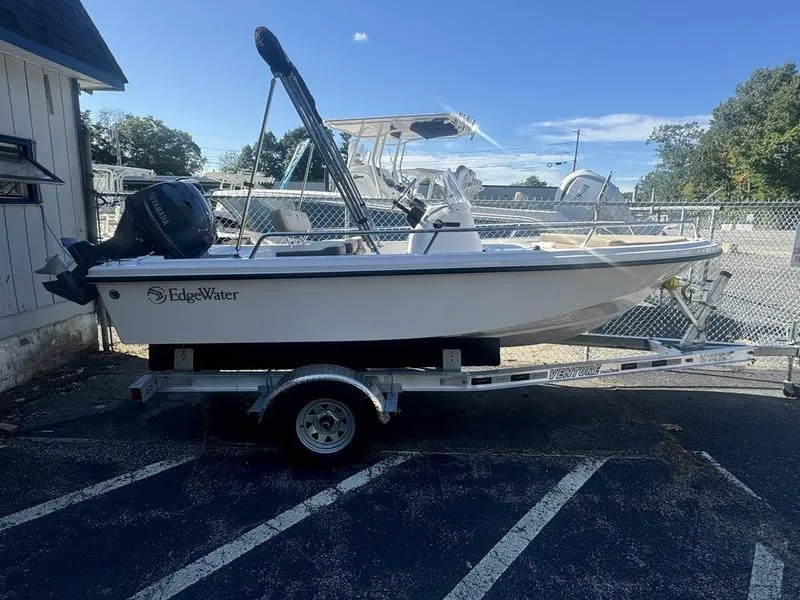 Slide: The Image of 2024 Edgewater 158CS boat on trailer in parking lot. - 0