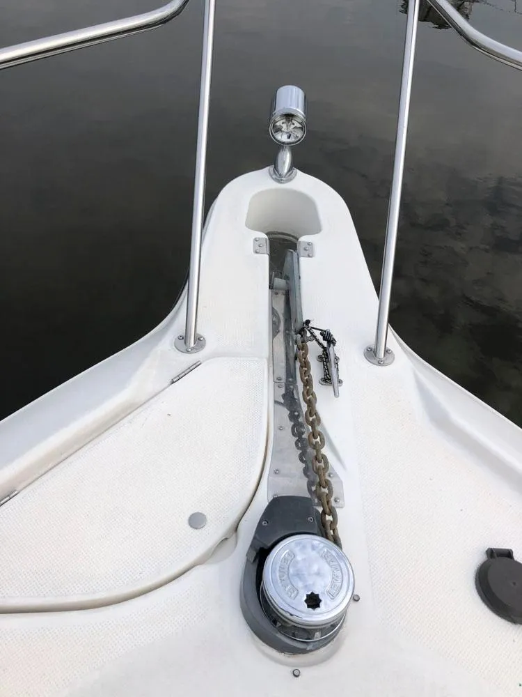 Slide: The Image of Bow of 2002 Maxum 3300 SCR with anchor chain and windlass. - 16