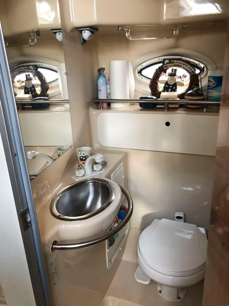 Slide: The Image of 2002 Maxum 3300 SCR boat bathroom with sink and toilet. - 18