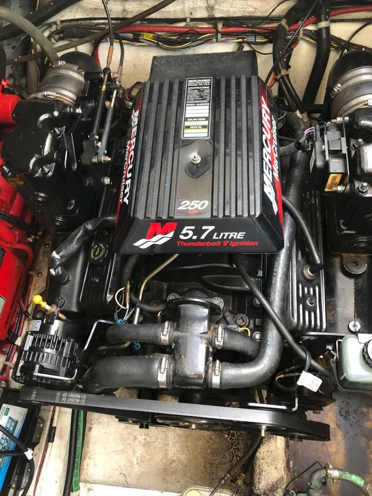 Slide: The Image of 2002 Maxum 3300 SCR engine compartment with Mercury 5.7L Thunderbolt V ignition. - 19