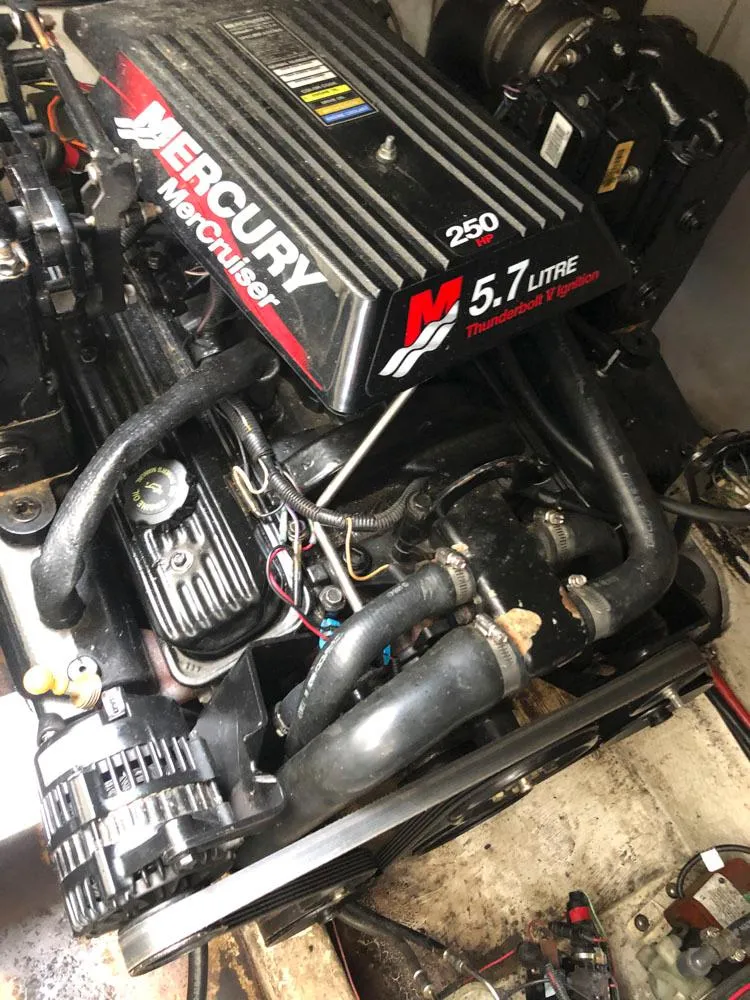 Slide: The Image of Engine of a 2002 Maxum 3300 SCR boat, featuring a Mercury 5.7 Litre motor. - 20