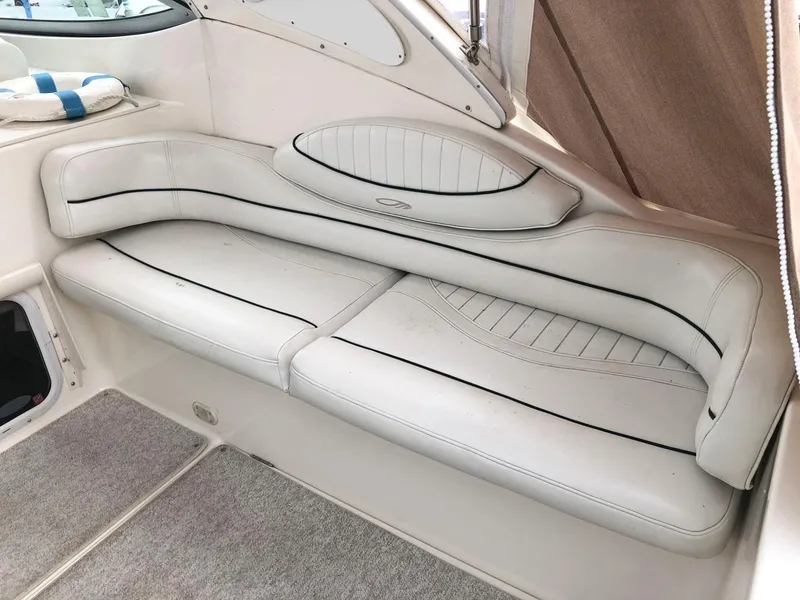 Slide: The Image of 2002 Maxum 3300 SCR boat interior with white leather seating. - 6