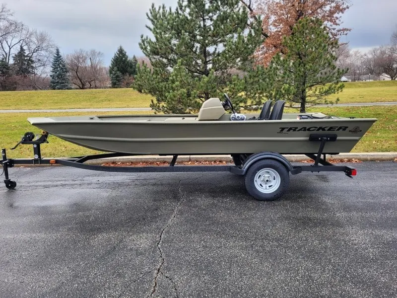 The Image of 2024 Tracker Grizzly 1754 SC boat on trailer in outdoor setting. - 0