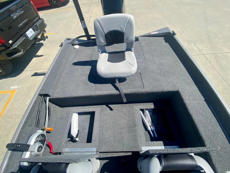 Slide: The Image of 2023 Crestliner 1600 Storm boat interior with seating and storage compartments. - 16