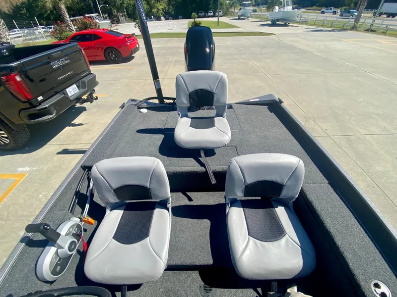 Slide: The Image of 2023 Crestliner 1600 Storm boat interior with three seats and steering console. - 7