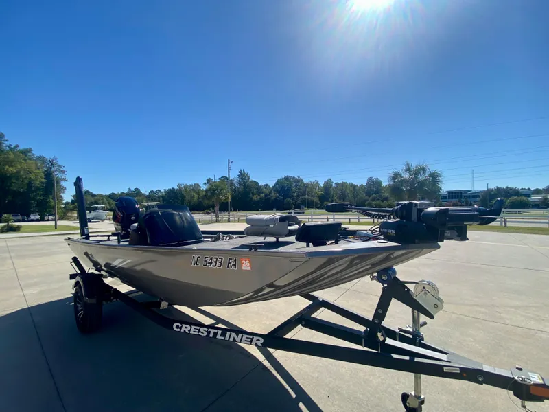 Slide: The Image of 2023 Crestliner 1600 Storm fishing boat on trailer under clear blue sky. - 1