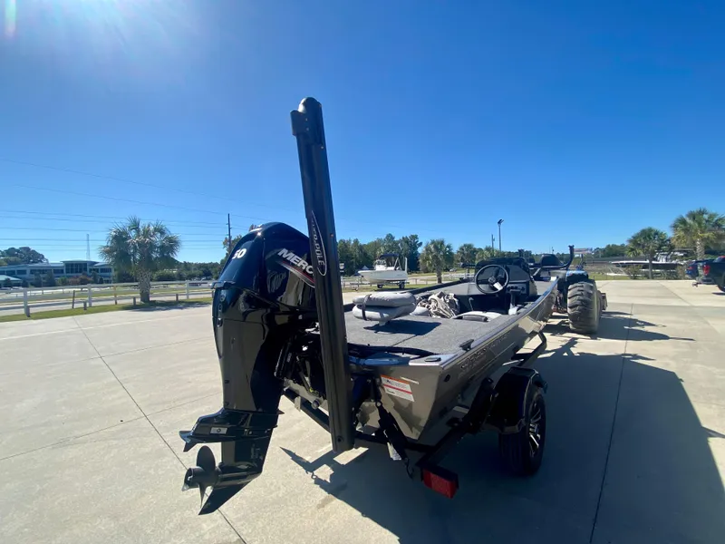 Slide: The Image of 2023 Crestliner 1600 Storm boat with Mercury outboard motor on a sunny day. - 3
