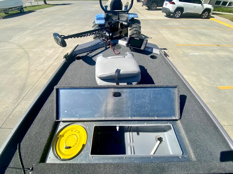 Slide: The Image of 2023 Crestliner 1600 Storm fishing boat with open storage compartments. - 14