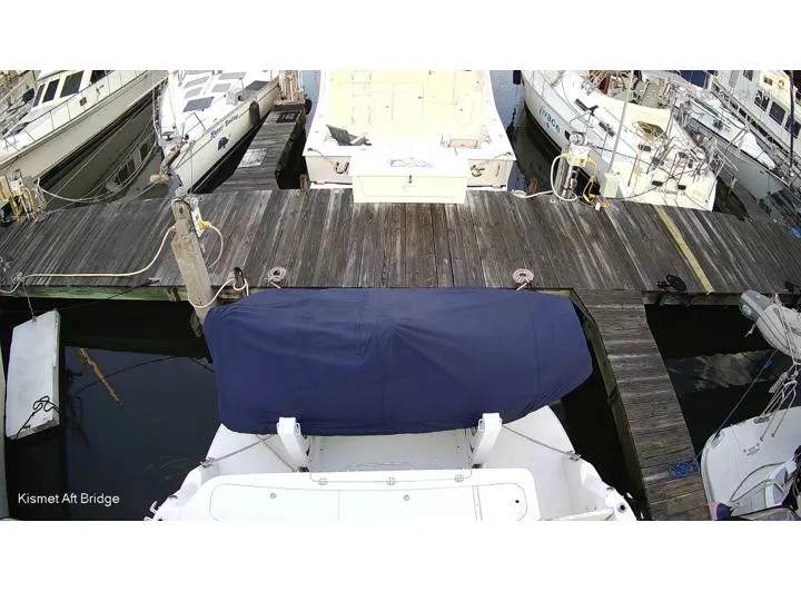 Slide: The Image of 2006 Sea Ray 52 Sedan Bridge docked at marina, covered aft deck. - 5