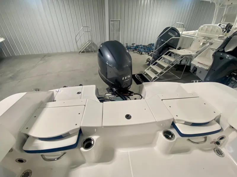 Slide: The Image of 2024 Robalo R180 Center Console boat with Yamaha outboard motor in showroom. - 4