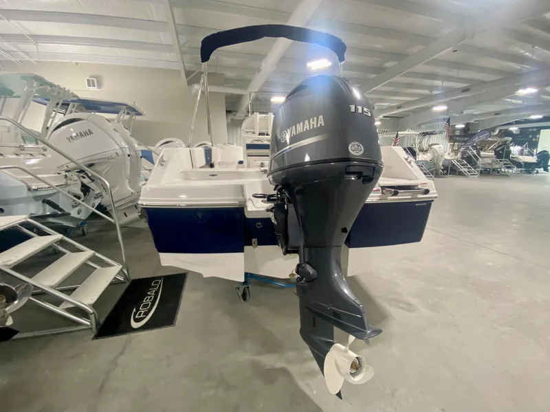 Slide: The Image of 2024 Robalo R180 Center Console boat with Yamaha 115 outboard motor in showroom. - 3