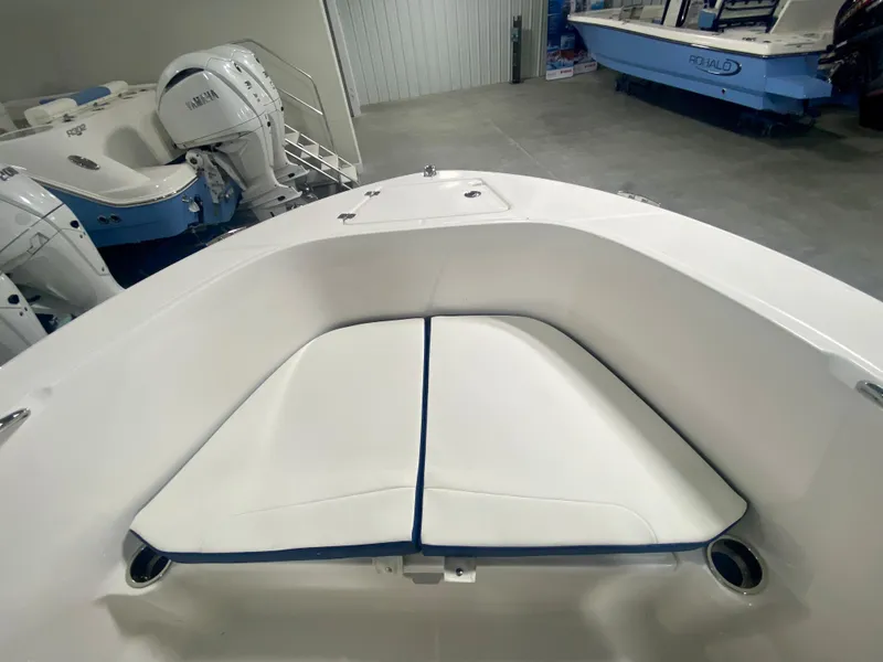 Slide: The Image of 2024 Robalo R180 Center Console boat interior with cushioned seating. - 15