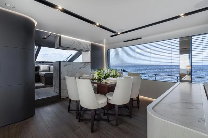 Slide: The Image of Luxurious dining area on the 2024 Astondoa AS8 yacht with ocean view. - 21