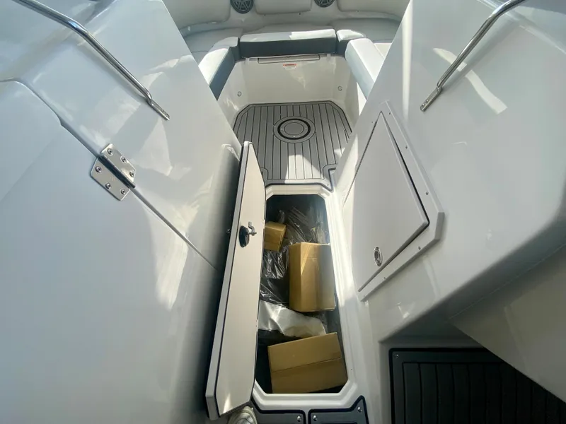 Slide: The Image of 2024 Starcraft SVX 230 OB boat interior storage compartments. - 21