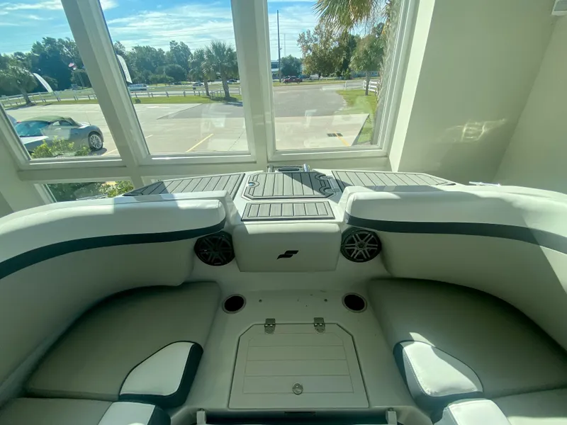 Slide: The Image of 2024 Starcraft SVX 230 OB boat interior with seating and storage compartments. - 27