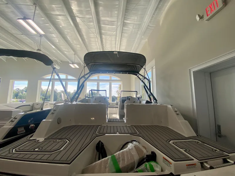 Slide: The Image of 2024 Starcraft SVX 230 OB boat displayed indoors. - 3