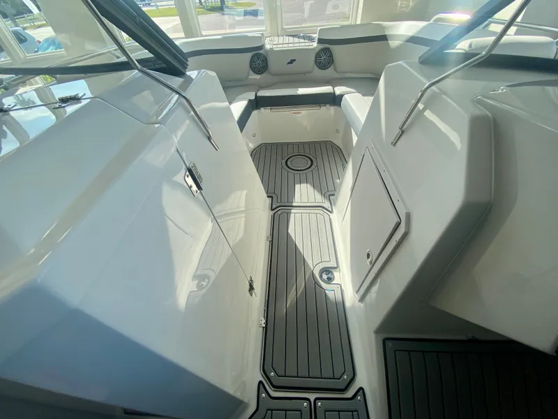 Slide: The Image of 2024 Starcraft SVX 230 OB boat interior with seating and storage compartments. - 19
