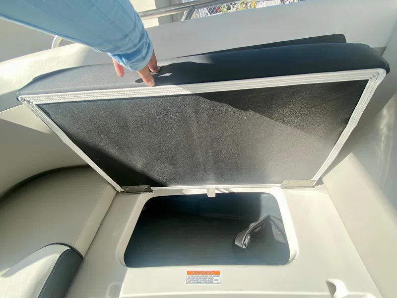 Slide: The Image of 2024 Starcraft SVX 230 OB boat storage compartment under seat. - 26
