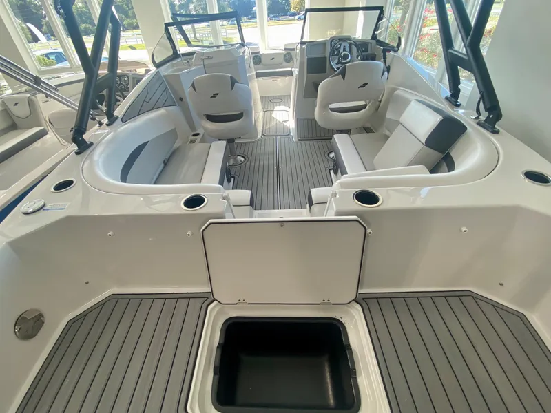 Slide: The Image of 2024 Starcraft SVX 230 OB boat interior with seating and storage compartments. - 5