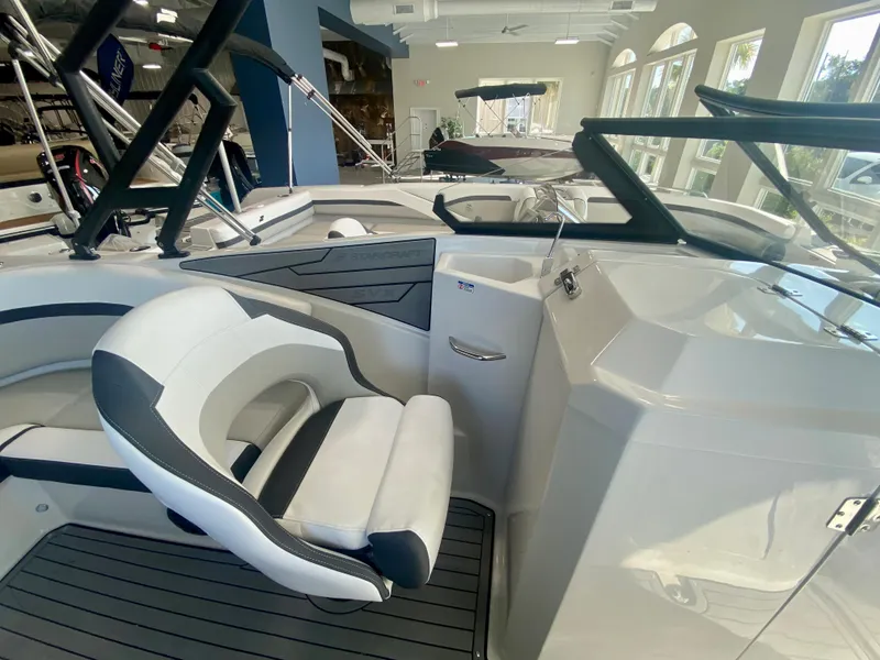 Slide: The Image of 2024 Starcraft SVX 230 OB boat interior with white and black seating. - 14