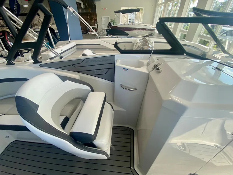 Slide: The Image of 2024 Starcraft SVX 230 OB boat interior with white and black seating. - 16
