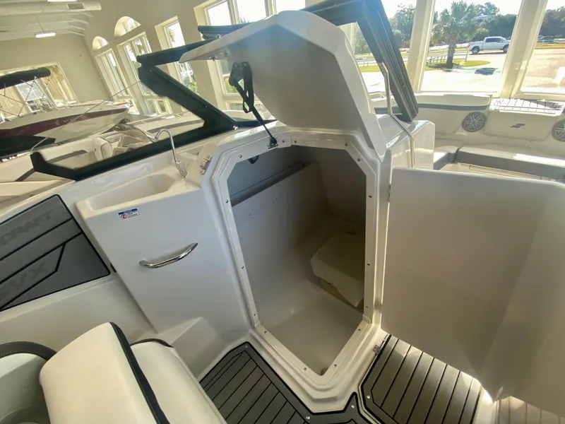 Slide: The Image of 2024 Starcraft SVX 230 OB boat interior storage compartment. - 18